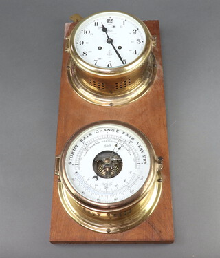 Schatz, a Royal Mariner striking ward room style clock with 13cm painted dial, Arabic numerals, contained in a gilt metal case together with a ditto barometer, raised on a wooden base 46cm x 20cm, complete with key 