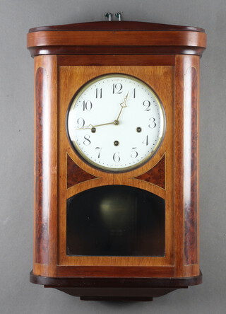 A 19th/20th Century French wall clock, the 18cm dial with Roman numerals, striking on a gong, contained in an inlaid figure walnut case complete with key 55cm h x 37cm w x 17cm d 