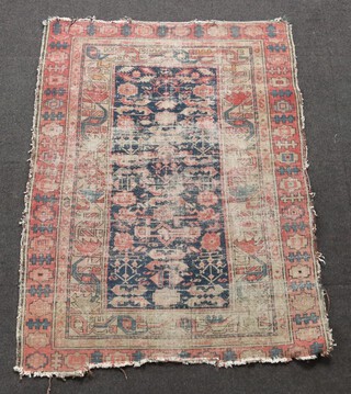 A red and blue ground Afghan rug with central medallion 143cm x 112cm 