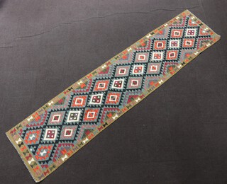 A green, black and orange ground Maimana Kilim runner with all over geometric design 
