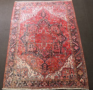 A red, white and blue Afghan carpet with central medallion within a multi row border 383cm x 275cm 