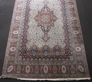 A machine made grey and brown ground Persian carpet with central medallion within multi row border, 501cm x 119cm 