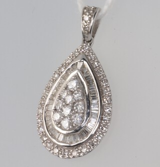 A white metal 9k diamond set pear shaped pendant 0.5ct, 1.5 grams, 22mm 