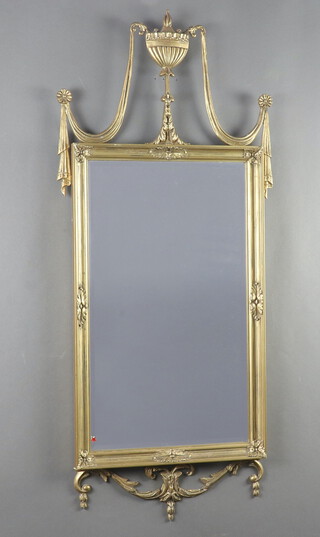 A Georgian style rectangular bevelled plate mirror contained in a gilt frame surmounted by a lidded urn to the top 106cm x 50cm 