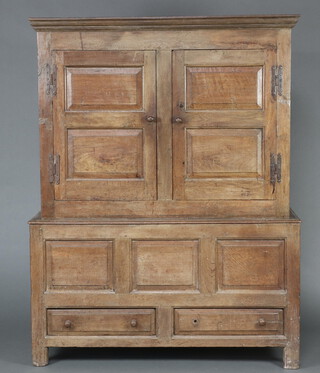 An 18th Century oak press cupboard with moulded cornice enclosed by panelled doors, the base fitted 2 drawers, wooden turned knob handles 178cm h x 125cm w x 52cm d 