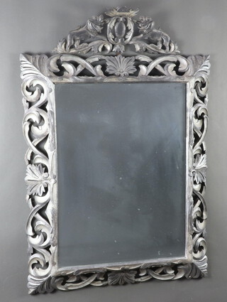 A Victorian Continental rectangular plate mirror contained in a pierced carved oak frame 133cm x 91cm  