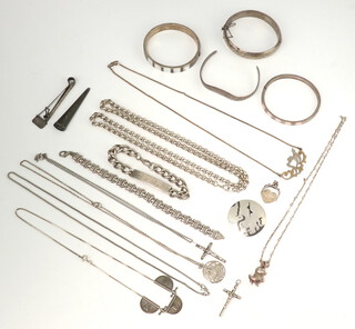 A silver bangle, silver necklace, identity bracelet and other items of silver jewellery, 266 grams 