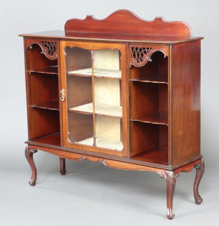 An Edwardian mahogany display cabinet with raised back, the centre fitted a cupboard enclosed by astragal glazed panelled doors flanked by niches fitted 2 shelves, raised on cabriole supports 126cm h x 128cm w x 42cm d 