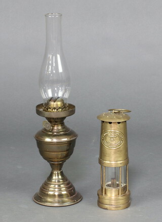 E Thomas and Williams Ltd, a miner's safety lamp no.17018 25cm h together with a gilt metal oil lamp 