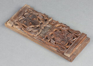 A 19th Century carved and pierced oak book slide 15cm x 33cm x 13cm  