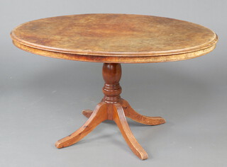 A Victorian oval quarter veneered figured walnut Loo top table raised on a pillar and tripod base 77cm h x 136cm w x 103cm d (sun bleached, water and contact marks in places)