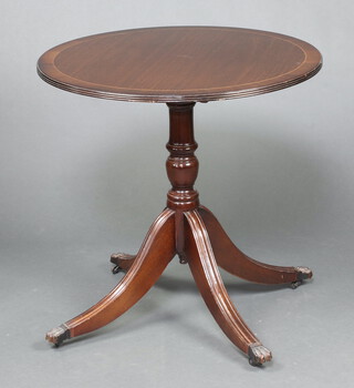 A circular Georgian style inlaid and crossbanded mahogany tea table, raised on a pillar and tripod base 76cm h x 76cm diam. 