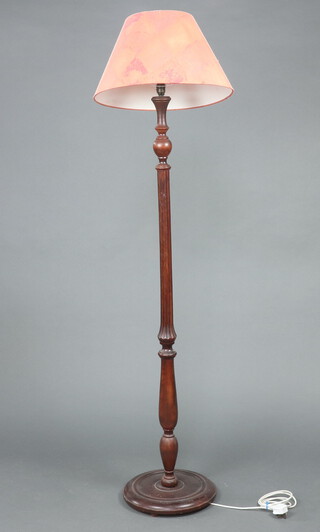 A beech turned and fluted standard lamp 