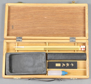 A Chinese writing set contained in a wooden box with hinged lid 3cm x 28cm x 13cm 