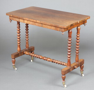 A Victorian rectangular rosewood stretcher table raised on turned supports with bobbin turned H framed stretcher 75cm h x 91cm w x 48cm d (small section of veneer missing to edge)