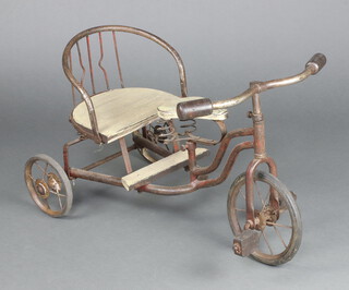 A child's metal framed model tricycle with solid seat and tyres 49cm h x 43cm x 35cm  
