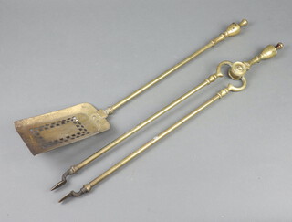 A pair of 19th Century brass Adam style fire tongs together with a matching shovel  