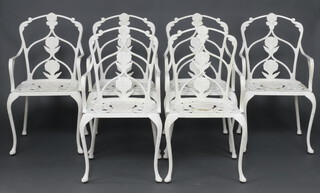A set of 6 white painted pierced aluminium garden  armchairs 
