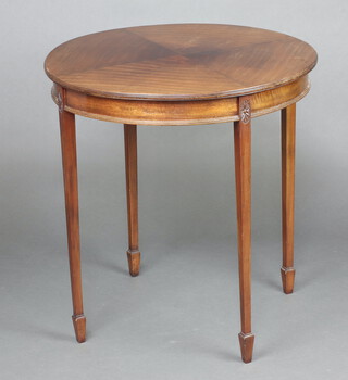 A circular Georgian style quarter veneered occasional table, raised on tapered supports 71cm h x 68cm diam. 