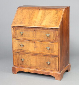 A Queen Anne style crossbanded and figured walnut bureau, the fall front revealing a fitted interior above 3 drawers, raised on bracket feet 100cm h x 76cm w x 43cm d (missing veneer to top and back left hand leg)  