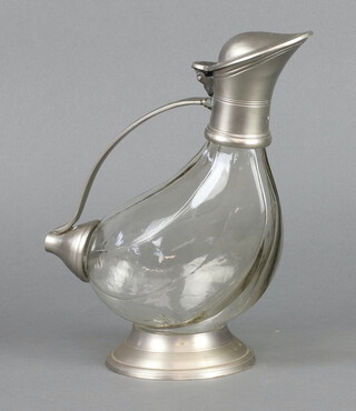 A Continental glass and pewter mounted decanter in the form of a duck 25cm h x 20cm diam. 