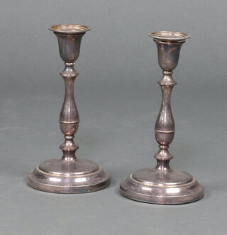 A pair of silver plated candlesticks with detachable sconces 25cm 