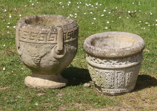 A circular goblet shaped garden urn with Grecian key and ring decoration 36cm h x 35cm diam. (large chip to base) and 1 other 29cm x 34cm 