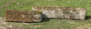 A well weathered and moss covered garden trough shaped planter 17cm h x 60cm w x 19cm d and 1 other 19cm x 91cm x 19cm 