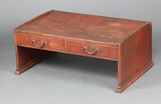 An Art Nouveau Oriental style oak occasional table fitted 2 drawers with iron drop handles 35cm h x 84cm w x 54cm d  