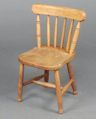 A child's elm stick and rail back Windsor chair raised on turned supports with H framed stretcher 54cm h (water mark to seat)