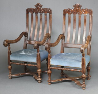 A pair of Edwardian, 17th Century style, Continental stick and rail back open arm chairs with upholstered seats 137cm h x 67cm w x 67cm d (some old repairs in places) 