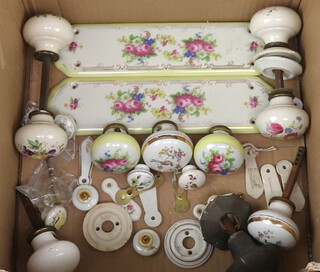 Two Victorian porcelain finger plates and a collection of Victorian porcelain door knobs 