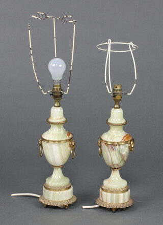 A pair of green onyx and gilt metal table lamps the form of urns 38cm h 