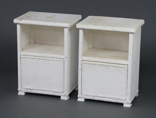 A pair of white painted loom bedside cabinets with recess above cupboard 56cm h x 40cm w x 30cm d 