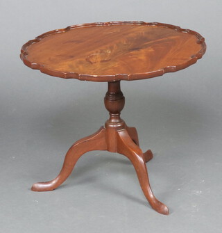 A Georgian style circular snap top wine table raised on pillar and tripod base 49cm h x 60cm diam. (contact marks in places)  