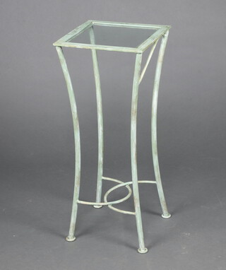 A square green painted metal lamp table with plate glass top raised on outswept supports 80cm h x 33cm w x 33cm d  