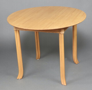 Lloyd Loom, a circular dining table raised on outswept supports 78cm h x 98cm diam.  