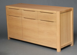 A contemporary light oak Winsor sideboard of 3 drawers above 3 cupboards 80cm h x 150cm w x 50cm d 
