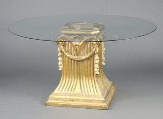 A fibre glass pedestal table in the form of a waisted Corinthian style column with plate glass top 80cm h x 153cm diam. 