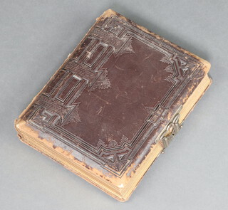 A Victorian leather bound family photograph album (spine damage and scuffing in places) 