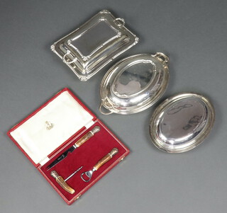 A 3 piece bottle opener/bar set comprising corkscrew, bottle opener and cheese knife, all with stag horn handles, contained in a red plush case and 3 silver plated entree dishes and covers 