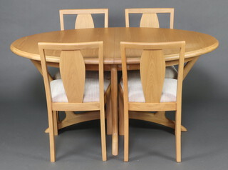 A contemporary light oak Winsor dining suite comprising oval extending dining table 156cm l x 99cm w together with a set of 4 slat back dining chairs with upholstered seats 89cm h