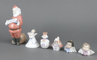 A Lladro figure of Father Christmas 22cm, four Christmas decorations and an angel 