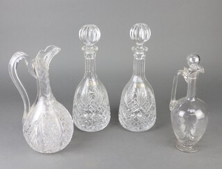 A cut glass ewer and stopper, 1 other ewer (handle f), a pair of mallet shaped decanters, together with a squat faceted cut glass bowl and a vase decorated fuchsia 25cm  