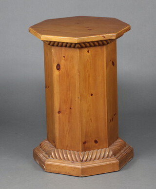 An octagonal pine pedestal with rope edge border 74cm h x 50cm w x 50cm d (contact marks in places)