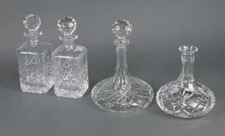 A pair of square spirit decanters and stoppers 27cm and 2 others