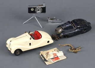 A Schuco Examico 4001 key wind sedan motorcar 14cm, a ditto Kommando Anno 2000 (a/f) and a Photoflash cigarette lighter 