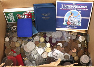 A large quantity of world coins and tokens 