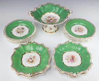 An Edwardian dessert service with green and gilt borders enclosing spring flowers, comprising a tazza, 11 plates (1 stuck), 4 serving dishes (1 stuck and all have ware to decoration and gilding) 