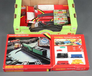 A Hornby clockwork Super train set R533, an OO gauge operating turn table set boxed, together with various track 